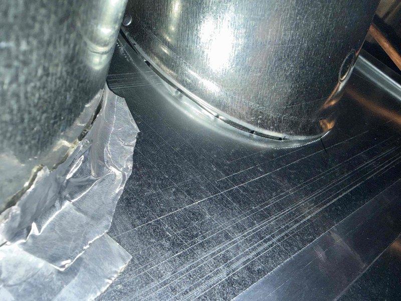 Responded to customer concern regarding unsealed ductwork at the furnace connection following new furnace installation. Inspected and verified proper sealing of ductwork connections with metallic tape as evidenced by photos. Addressed customer's request to reinstall bedroom damper that was removed during original installation.