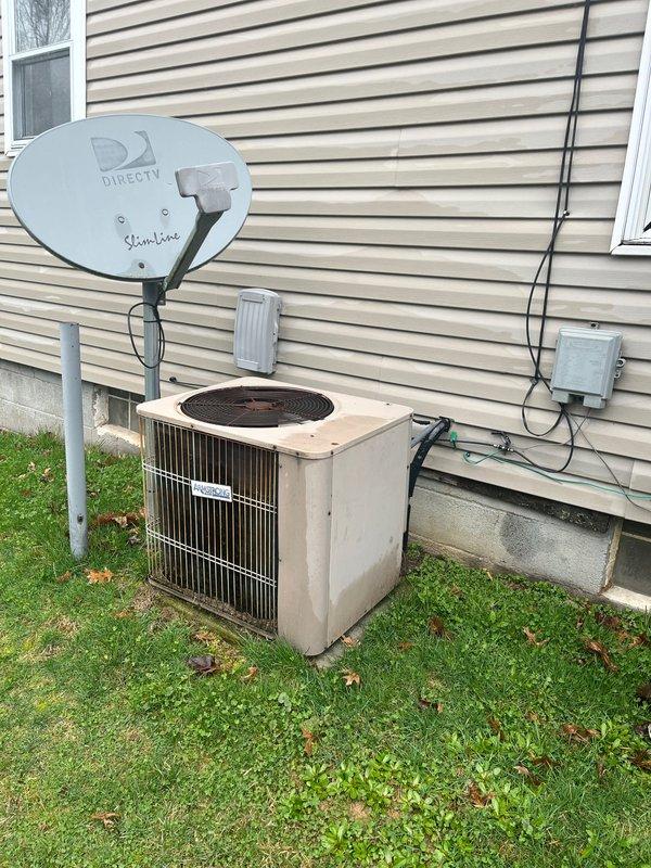 Performed furnace and AC retrofit on existing residential HVAC system. Installed new LACAN air handler unit alongside replacement HEAT-branded furnace with PVC exhaust ventilation in basement utility area. Exterior inspection confirmed proper connection to existing outdoor condensing unit mounted adjacent to foundation.