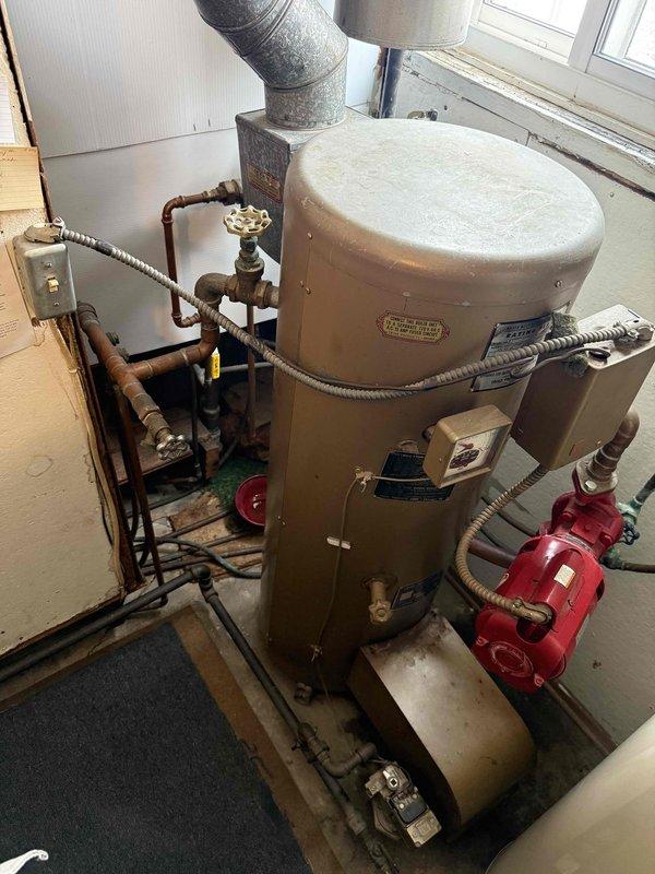 Responded to service call for boiler leak. Inspected system and identified failed brass valve assembly on copper supply line. Replaced defective valve, pressure tested connections, and verified proper system operation with no further leaks observed.