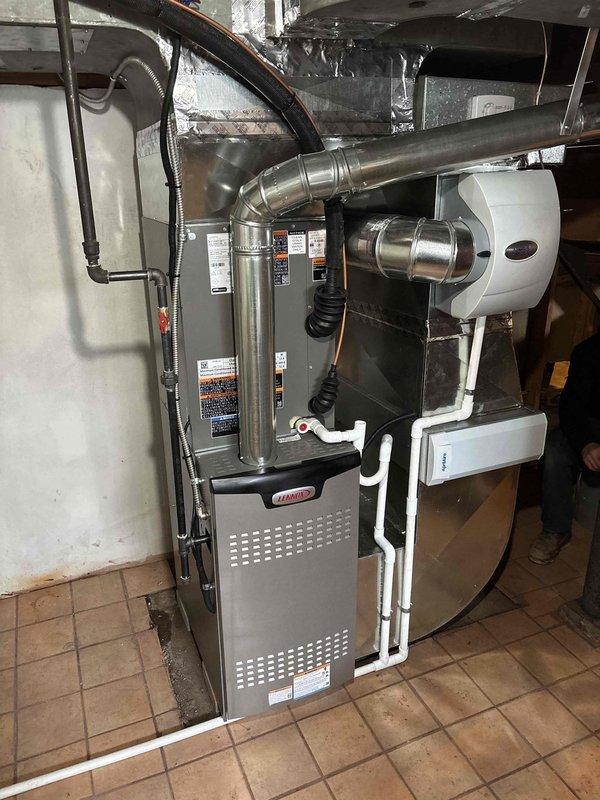 Successfully installed a complete Lennox HVAC system in the utility room, including furnace unit with proper metal ductwork connections, ventilation components, and PVC drainage piping. System installation included a chimney liner and all necessary exhaust venting with appropriate elbow joints, ensuring proper operation and compliance with ventilation requirements.