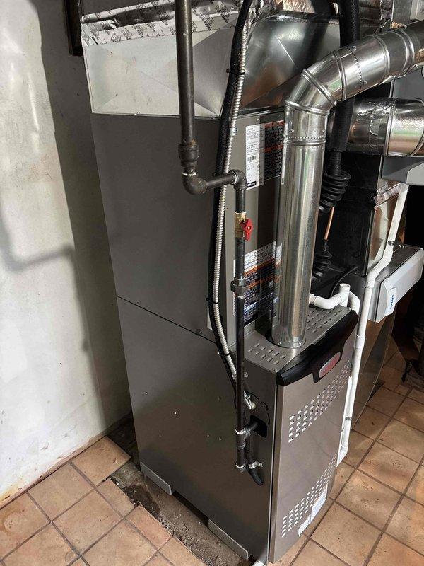 Successfully installed a complete Lennox HVAC system in the utility room, including furnace unit with proper metal ductwork connections, ventilation components, and PVC drainage piping. System installation included a chimney liner and all necessary exhaust venting with appropriate elbow joints, ensuring proper operation and compliance with ventilation requirements.