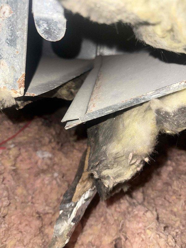 Responded to service call for non-functioning heating system. Inspection revealed disconnected ductwork in attic with visible separation at junction points. Reconnected and sealed disconnected ductwork segments, restoring proper airflow and system functionality.