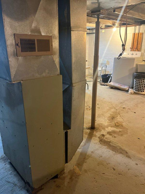 Completed installation of AC add-on to existing Trane XR 80 furnace system in basement. Inspected and verified proper connection of ductwork, including rectangular and round pipes, to accommodate new AC components. Ensured all ventilation, copper gas piping, and electrical connections meet code requirements for the integrated HVAC system.