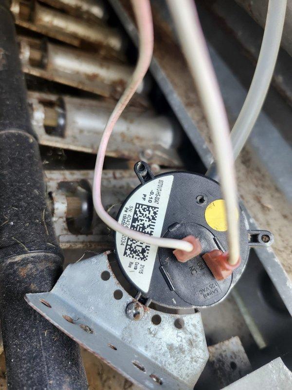 Responded to no heat call for back pavilion area with blank thermostat display. Upon inspection, diagnosed failed pressure switch on rooftop HVAC unit serving the affected zone. Replaced defective pressure switch, restored power to thermostat, and verified system operation with successful heating cycle.