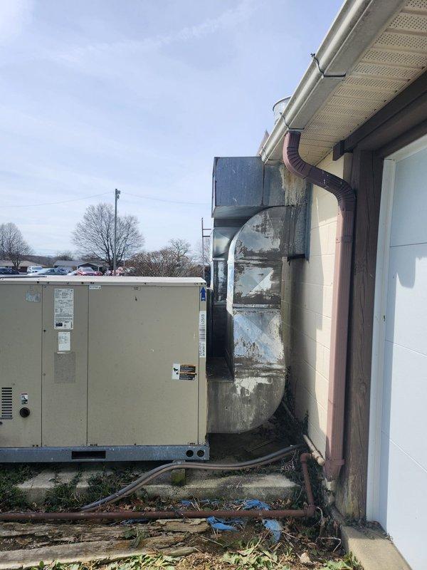 Responded to no heat call for back pavilion area with blank thermostat display. Upon inspection, diagnosed failed pressure switch on rooftop HVAC unit serving the affected zone. Replaced defective pressure switch, restored power to thermostat, and verified system operation with successful heating cycle.