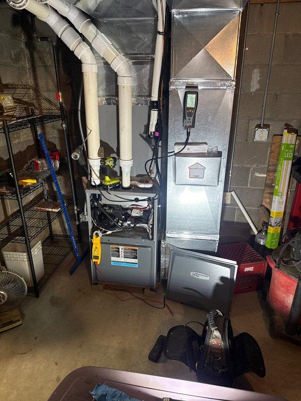 Responded to customer complaint of burning plastic smell from 3-year-old gas furnace. Performed comprehensive system inspection and combustion analysis using Testo 327-1 analyzer. Flue gas readings showed 55.4% combustion air, 78% efficiency, 11 ppm CO, and 18 ppm CO-HF, all within acceptable parameters. Inspected heat exchanger, burner assembly, blower motor, and electrical connections for signs of overheating or melting components. Verified proper operation of PVC venting system and condensate drainage. Checked air handler and ductwork for any foreign materials or debris that could cause odor when heated. System operating normally with no abnormalities detected during inspection. Advised customer that new furnace odors can occur during initial heating cycles but to monitor and contact if smell persists or worsens.