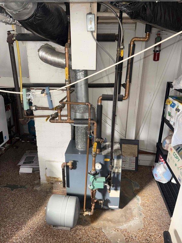 Completed scheduled heating maintenance on residential boiler system over 10 years old per maintenance agreement. Performed comprehensive inspection of boiler unit, verified proper operation of pump assembly, checked all electrical connections and controls, and inspected copper piping, expansion tank, and gas line connections for leaks or deterioration. All components found operating within normal parameters with no immediate repairs required.