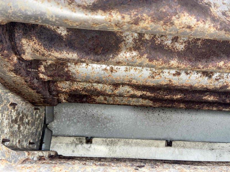 Completed fall maintenance inspection on commercial HVAC system. Documented severe corrosion throughout evaporator coils and refrigerant piping, with extensive rust, oxidation, and mineral deposits indicating prolonged moisture exposure and deteriorated system components requiring immediate attention and potential replacement to prevent system failure.