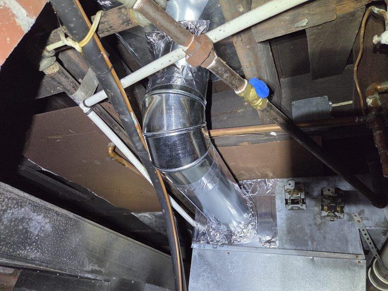 Replaced HVAC ductwork in basement and attic areas where original sections were removed during asbestos abatement. Installed new metallic ductwork with proper transitions, elbows, and sealed connections throughout exposed ceiling joists in basement space and integrated new vertical duct runs through upper structural cavities. All ductwork was properly secured to existing framing, sealed at joints with foil tape, and routed to maintain efficient airflow while working around existing plumbing, electrical conduit, and building infrastructure.