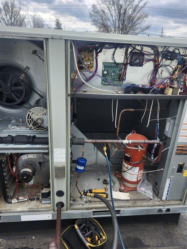 Replaced failed evaporator coil, thermal expansion valve, and filter drier on commercial rooftop HVAC unit. All refrigerant lines were properly brazed, system was evacuated and recharged to manufacturer specifications, and unit tested successfully for proper operation.