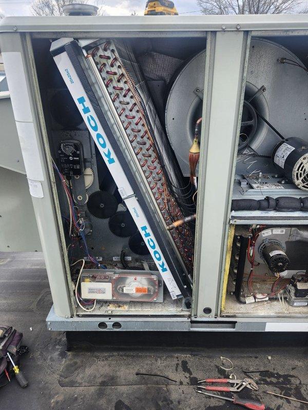 Replaced failed evaporator coil, thermal expansion valve, and filter drier on commercial rooftop HVAC unit. All refrigerant lines were properly brazed, system was evacuated and recharged to manufacturer specifications, and unit tested successfully for proper operation.