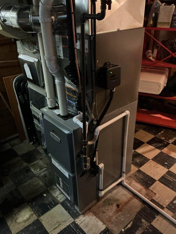 # HVAC Install - A/C Only

Completed full air conditioning system replacement at residential property. Removed existing A/C equipment and installed new condensing unit with matching evaporator coil. Connected refrigerant lines using copper piping with proper brazing techniques and insulation. Integrated new evaporator coil with existing furnace system to ensure proper airflow and cooling distribution throughout the home.

Verified all electrical connections meet code requirements and installed proper disconnect switch at outdoor unit. Charged system with appropriate refrigerant type and quantity per manufacturer specifications. Performed leak test on all refrigerant connections and joints to ensure system integrity. Tested system operation through complete cooling cycle, confirming proper compressor function, adequate airflow, and correct temperature differential across evaporator coil.

Inspected and serviced existing humidifier unit during installation, checking evaporative pad condi