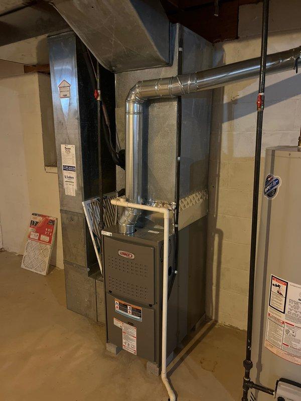 Completed full HVAC system replacement in basement mechanical room, installing new Lennox furnace unit with integrated ductwork connections. Configured sheet metal supply ducts and flexible return ducting, ensuring proper airflow distribution throughout the residence. All equipment mounted, secured, and tested for operational functionality per manufacturer specifications.