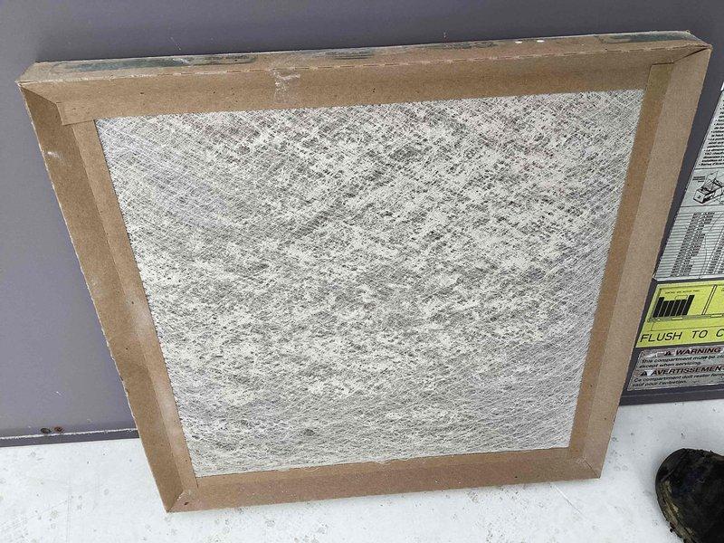 Responded to no heat call on rooftop unit serving back space. Upon inspection, found heavily soiled air filter restricting airflow, causing unit to shut down on safety limits. Replaced dirty filter with new filter, restored proper airflow, and verified unit operation with adequate heat output to affected zone.