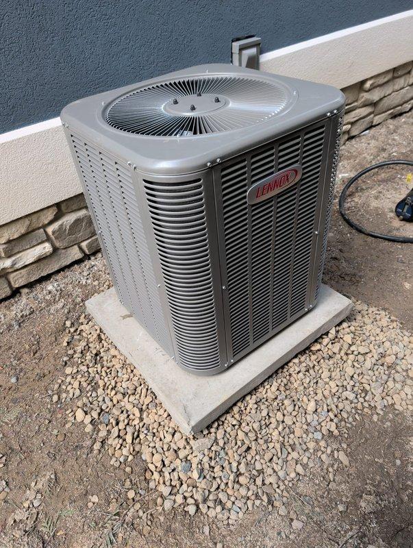 Completed new construction HVAC installation including final placement and connection of outdoor condensing unit on concrete pad with proper gravel base, installed Aprilaire 600M whole-home humidifier integrated into the system, and mounted customer-supplied thermostat with full system programming and testing. All equipment commissioned and verified operational per manufacturer specifications.