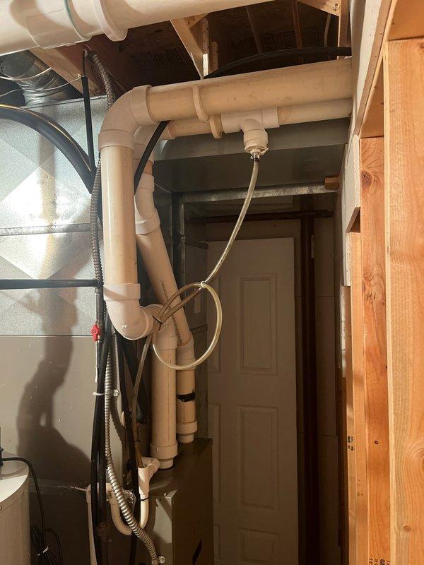 Completed comprehensive furnace replacement estimate for residential heating system. Assessed existing furnace installation in basement utility area, documenting current ductwork configuration including metal supply plenum, flexible black corrugated ducting, and PVC condensate drainage lines. Photographed equipment location, clearances, and existing infrastructure to provide accurate replacement recommendations and ensure proper sizing for new high-efficiency furnace system.