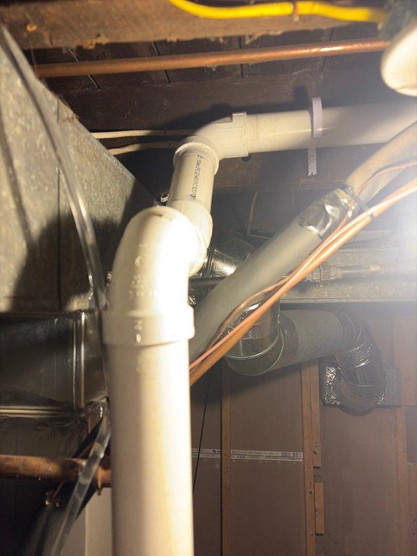 Completed furnace replacement in residential basement. Removed existing heating unit and installed new furnace system with proper venting using white PVC piping for intake and exhaust. Routed condensate drainage line along floor perimeter to appropriate discharge location. All installations performed to manufacturer specifications and local building codes, with system tested and confirmed operational upon completion.