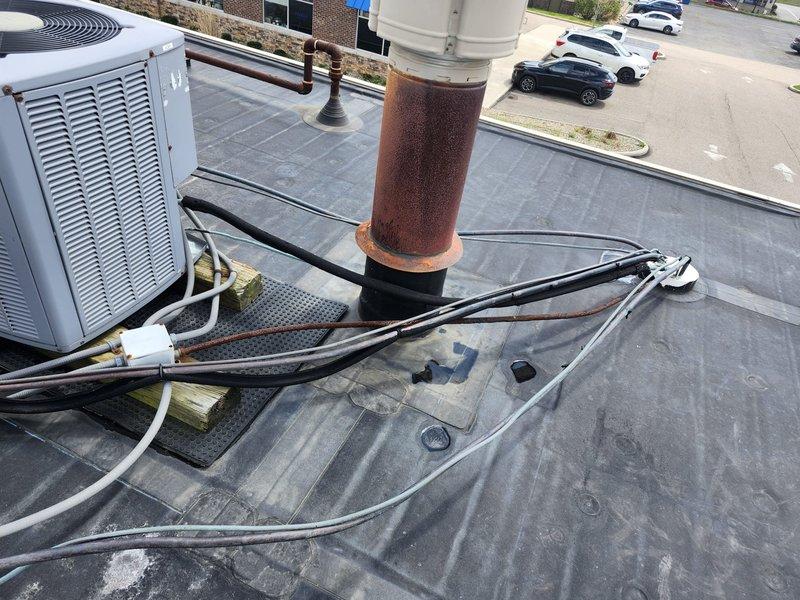 Completed spring maintenance contract visit on commercial rooftop HVAC system with multiple units. Performed routine inspections and documented equipment conditions, noting significant rust corrosion on cylindrical ductwork requiring future attention. All units operational upon completion of scheduled preventive maintenance procedures.