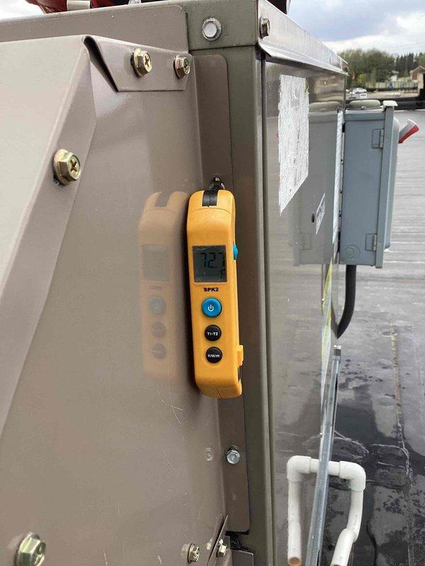 Completed scheduled commercial cooling maintenance on rooftop HVAC unit. Performed system diagnostics using digital measurement equipment, recording temperature reading of 72°F at electrical panel. Accessed internal compartment to inspect blower assembly, electrical connections, and ductwork components. Removed packaging material that had been inadvertently left inside unit during previous service. Verified all electrical connections, wiring harnesses, and mechanical components for proper operation and secured access panel upon completion of inspection.