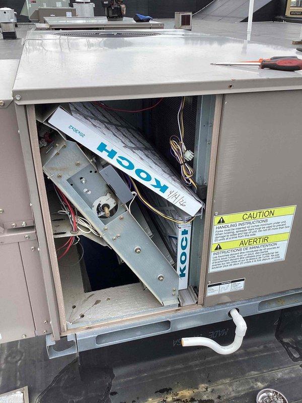 Completed scheduled commercial cooling maintenance on rooftop HVAC unit. Performed system diagnostics using digital measurement equipment, recording temperature reading of 72°F at electrical panel. Accessed internal compartment to inspect blower assembly, electrical connections, and ductwork components. Removed packaging material that had been inadvertently left inside unit during previous service. Verified all electrical connections, wiring harnesses, and mechanical components for proper operation and secured access panel upon completion of inspection.