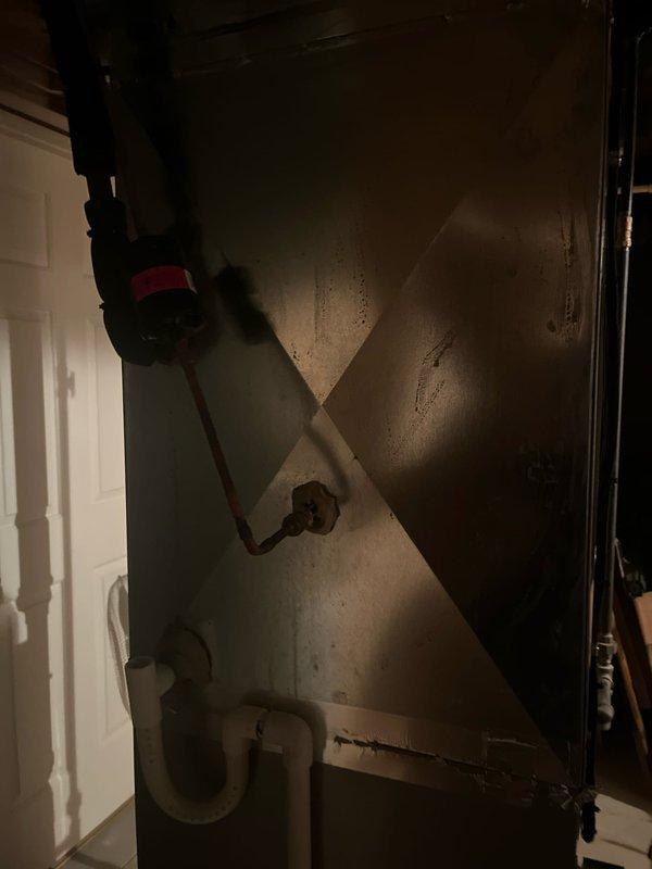 Conducted comprehensive assessment of existing HVAC system for air conditioning replacement estimate. Evaluated current Carrier furnace installation in basement utility area, documenting equipment specifications, ductwork configuration, and spatial constraints for potential system upgrade. Photographed existing mechanical infrastructure including metallic plenum connections, PVC condensate drainage lines, and electrical conduit routing to determine compatibility requirements for new cooling equipment installation.
