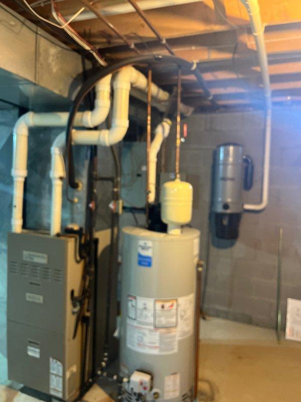 Completed full HVAC system assessment for replacement in residential basement mechanical room. Documented existing Armstrong Ultra V furnace, water heater, ductwork configuration, and associated PVC venting system showing signs of age and wear, including discolored metal ductwork. Provided comprehensive estimate for complete system replacement to address customer's request for expedited full system upgrade.