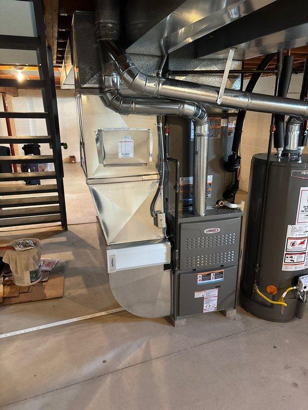 Completed full HVAC system replacement in basement mechanical room, installing new Lennox furnace and air conditioning system. Removed existing equipment and installed new furnace with proper ductwork connections, including metallic supply and return plenums with sealed joints. Connected all necessary electrical wiring, gas lines, and condensate drainage. Performed system startup, verified proper airflow using diagnostic equipment, and confirmed all safety controls operational.