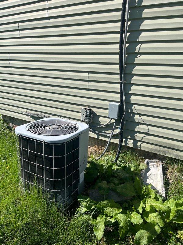 Conducted on-site evaluation for complete HVAC system replacement. Assessed existing outdoor condensing unit and attic-mounted air handler, both showing age and wear. Documented current equipment specifications, measured installation areas, and photographed existing system configuration including exterior unit placement, electrical disconnect, attic access conditions, and ductwork routing to provide comprehensive replacement estimate.