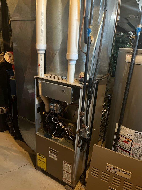 Completed full HVAC system retrofit including removal of existing equipment and installation of new Arcoaire outdoor condensing unit and Armstrong Air furnace with air handler. Installed new PVC intake and exhaust venting for high-efficiency furnace operation, connected all ductwork, and positioned outdoor unit on existing concrete pad with proper clearances. Verified all electrical connections, gas lines, and refrigerant lines are secure, tested system operation, and confirmed heating and cooling functionality meets manufacturer specifications.