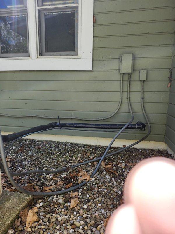Completed full AC replacement at residential property. Removed existing condensing unit and installed new Lennox CU5 series air conditioning system on concrete pad with proper gravel base. Routed new lineset using flexible conduit along foundation, secured conduit to exterior wall with appropriate mounting hardware and junction boxes. Installed matching evaporator coil, completed all refrigerant connections, performed vacuum and pressure tests, and charged system to manufacturer specifications. Verified proper airflow, temperature differential, and electrical connections. System operational and performing within normal parameters.