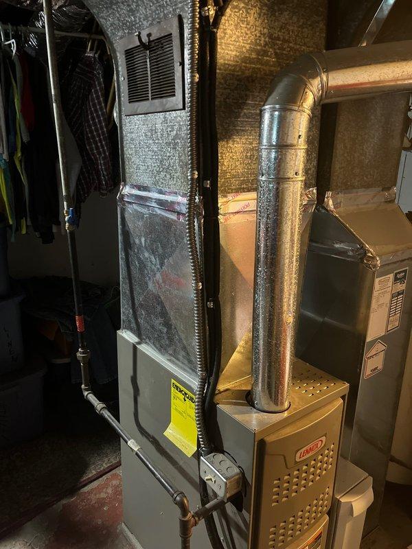 Completed full air conditioning system replacement in residential utility space. Installed new air handler unit and furnace with associated metallic ductwork, ensuring proper connections to existing duct network. System tested and operational upon completion.