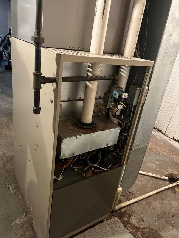 Completed furnace replacement estimate for existing HVAC system in basement mechanical room. Inspected current furnace unit, documented equipment specifications, and photographed installation including ductwork connections, gas piping, electrical components, and venting system. Assessed blower assembly, heat exchanger, gas valve, and overall cabinet condition to provide comprehensive replacement recommendations and equipment sizing requirements.