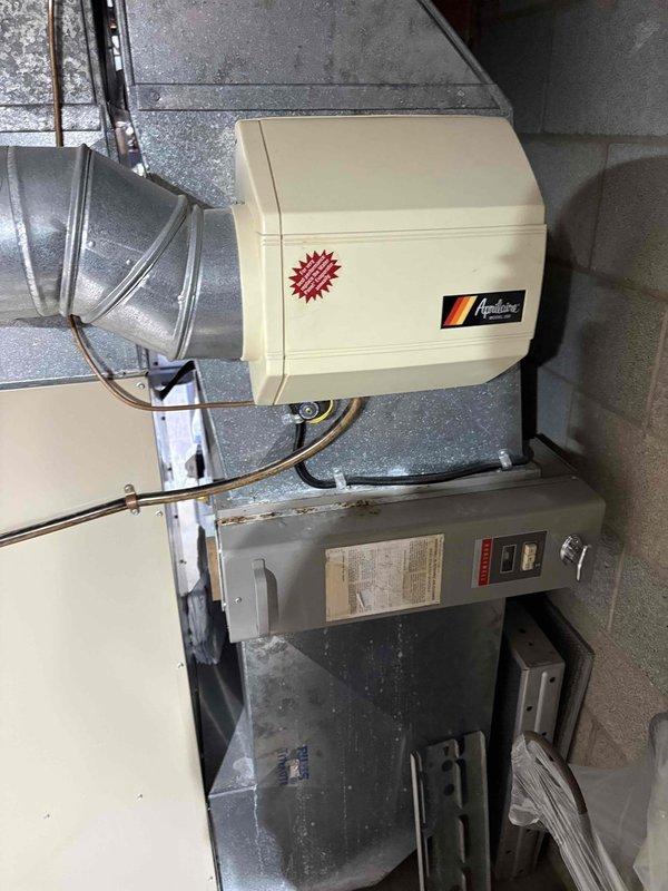 Completed routine cooling maintenance visit on residential HVAC system. Performed inspection of outdoor condenser unit, which showed normal weathering consistent with age, and verified proper operation of indoor air handler and humidifier system. All components functioning within normal parameters at time of service.