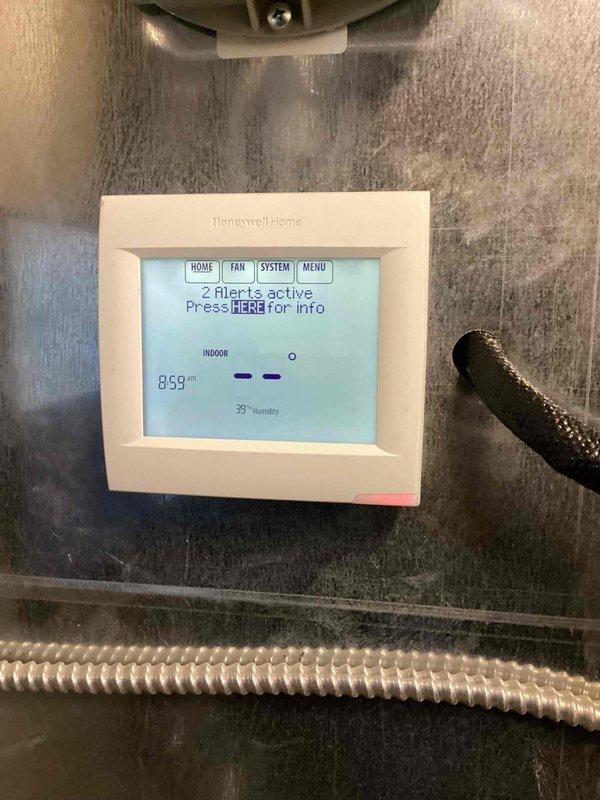 Responded to warranty callback for recently installed commercial thermostat system where one unit was not functioning properly and building occupants had no climate control. Upon arrival, diagnosed thermostat displaying erroneous temperature reading of 869°F with active system alerts. Corrected sensor malfunction, verified proper communication between thermostat and HVAC equipment, and restored full operational control with accurate temperature readings and system functionality.