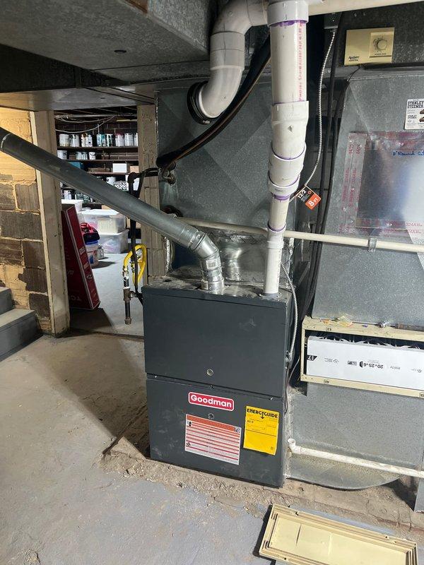 Completed comprehensive HVAC estimate for AC retrofit in residential basement utility area. Assessed existing Goodman furnace system and surrounding infrastructure, including aging copper piping, moisture management equipment, and ventilation components. Documented current equipment configuration, PVC condensate drainage system, and overall mechanical room conditions to provide accurate replacement recommendations for modernized air conditioning system integration.