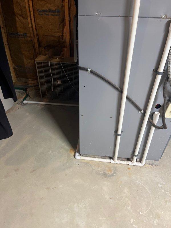 Completed full HVAC system replacement due to R22 refrigerant depletion in existing air conditioning unit. Installed new high-efficiency furnace with proper PVC venting system and matching air handler unit secured to basement wall with appropriate mounting hardware and refrigerant line connections. System commissioned and tested for proper operation.