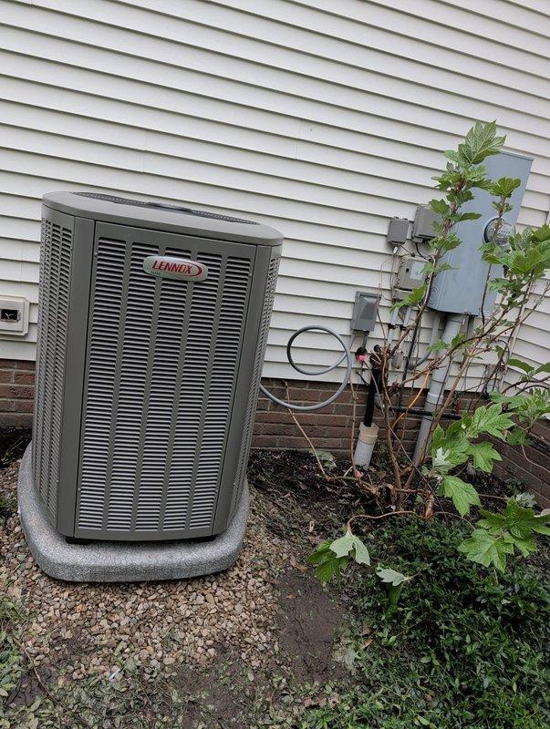 Completed full HVAC system retrofit installation including new Lennox air conditioning condenser unit and furnace system. Mounted AC unit on concrete pad with proper gravel base and installed electrical disconnect box with appropriate conduit routing. Ran refrigerant line set with black insulation from interior equipment to exterior condenser, ensuring proper connection and sealing. Installed furnace system in interior utility space with PVC venting routed vertically through wall and ceiling penetrations. All electrical connections completed to code with proper disconnect switches installed. System tested and verified operational with proper airflow, refrigerant charge, and combustion parameters within manufacturer specifications.