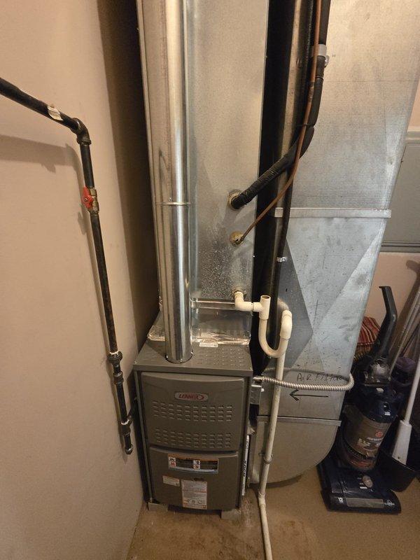 Completed commercial furnace replacement in utility room. Removed existing heating unit and installed new Lennox furnace with proper venting through metallic flue pipe, connected refrigerant lines and gas supply with shutoff valve, and integrated system with existing ductwork. All components tested and operational upon completion.