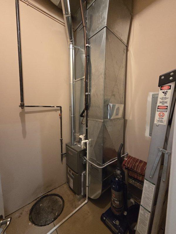 Completed commercial furnace replacement in utility room. Removed existing heating unit and installed new Lennox furnace with proper venting through metallic flue pipe, connected refrigerant lines and gas supply with shutoff valve, and integrated system with existing ductwork. All components tested and operational upon completion.