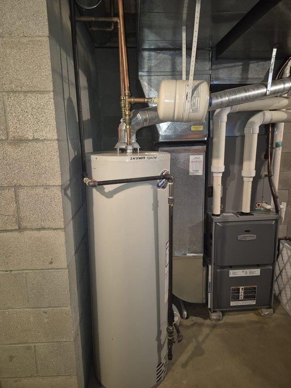 Completed spring maintenance on residential cooling system. Performed comprehensive inspection of HVAC equipment, verified proper operation of furnace and associated components, and documented equipment condition including water heater and utility room installations. All systems checked and found operational with no immediate service needs identified.
