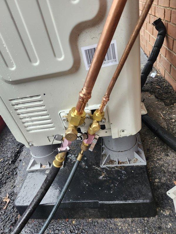 Responded to commercial HVAC callback to address refrigerant leaks at flare connections on outdoor condensing unit. Upon arrival, inspected brass service valves and copper refrigerant line connections where leaks were previously identified. Repaired faulty flare connections, pressure tested system to verify leak elimination, and confirmed proper refrigerant charge levels. Unit returned to normal operation with all connections secure and system operating within manufacturer specifications.