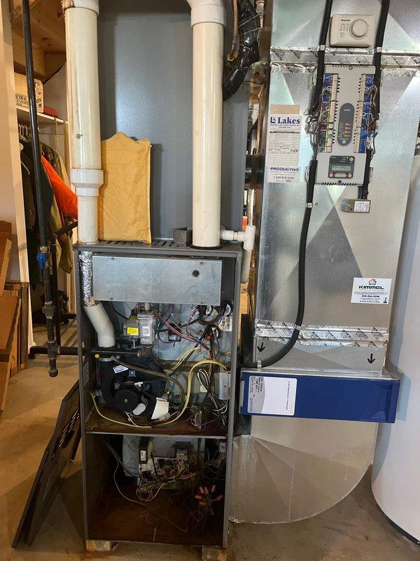 Completed comprehensive HVAC estimate for replacement of existing propane furnace and heat pump system in residential basement utility area. Assessed current equipment configuration including furnace with exposed internal components, air handler unit, and associated ductwork and drainage systems. Provided recommendations for new system installation with surge protector integration to protect equipment from electrical damage and ensure optimal performance and longevity of replacement units.