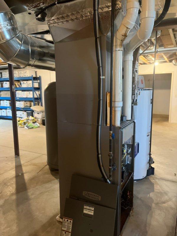 Completed comprehensive HVAC estimate for replacement of existing propane furnace and heat pump system in residential basement utility area. Assessed current equipment configuration including furnace with exposed internal components, air handler unit, and associated ductwork and drainage systems. Provided recommendations for new system installation with surge protector integration to protect equipment from electrical damage and ensure optimal performance and longevity of replacement units.