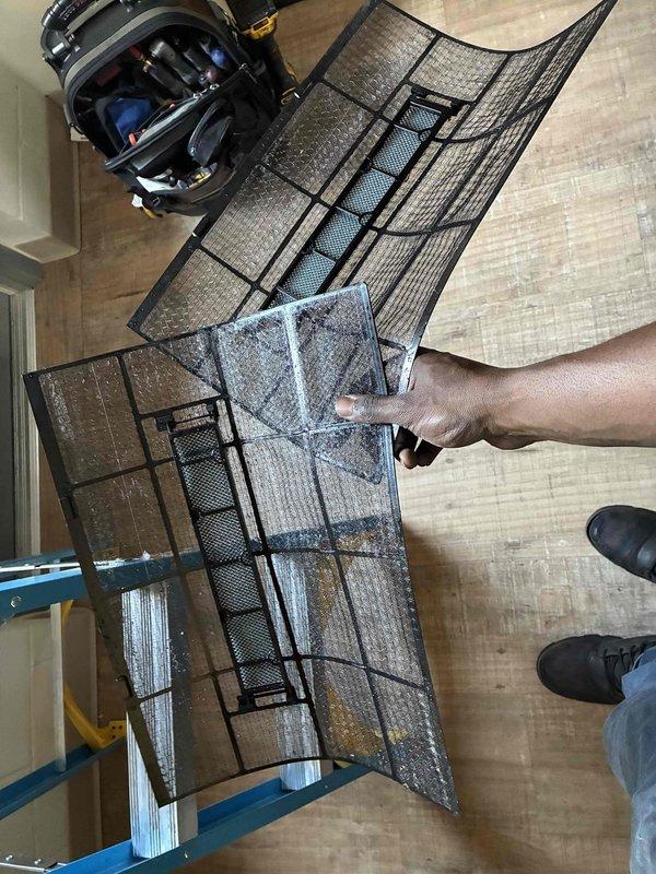 Completed scheduled commercial cooling maintenance visit. Inspected HVAC system located in ceiling space, removed and replaced dirty air filter showing significant dust and debris accumulation. Verified Koch unit operation and checked system components including filter housing and associated piping connections for proper function.
