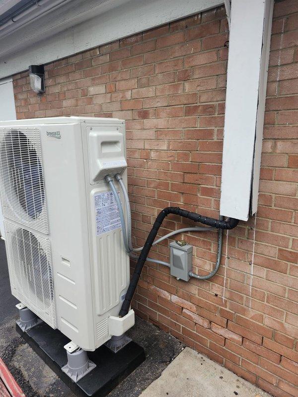 Coordinated with security alarm company on-site to address condenser wiring integration after removal of previous system. Completed electrical connections at outdoor condensing unit, properly terminating power and control wiring to terminal block within disconnect enclosure, and documented installation of control board with associated low-voltage connections for alarm system interface.