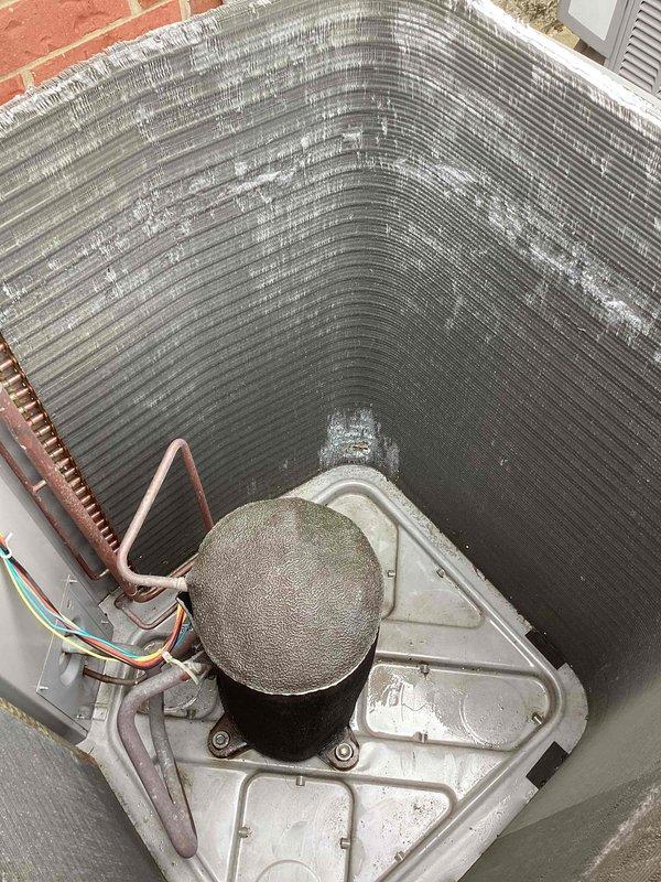 Completed scheduled commercial cooling maintenance on two rooftop HVAC condensing units. Performed visual inspection of both systems, noting dirt and debris accumulation on heat exchanger coils and fan assemblies. Documented equipment condition with photographs showing operational components including compressor sections, fan motors, refrigerant line connections, and electrical wiring. Both units accessible and operational at time of service visit.