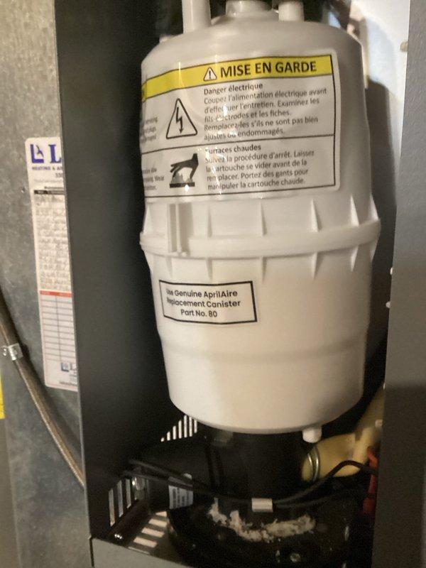 Completed spring maintenance on residential cooling system. Inspected and serviced HVAC equipment, including verification of April Aire humidifier component (Part No. 80 replacement canister) installation and proper operation. Confirmed all supply and return air vents functioning correctly throughout living spaces, with system operating within normal parameters.