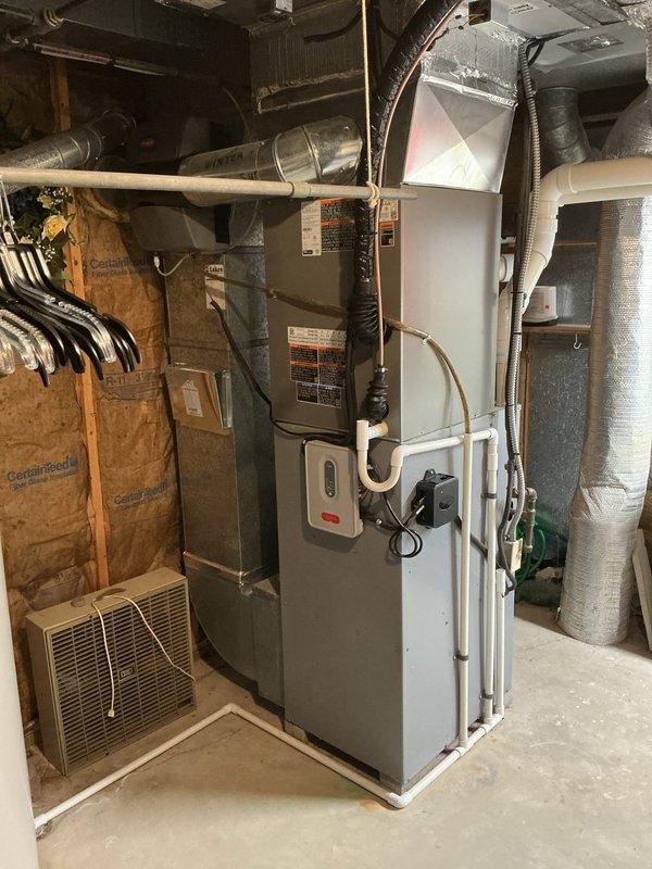 Completed full air conditioning system replacement including outdoor condensing unit and indoor evaporator coil. Installed new copper refrigerant line set with proper insulation, connected to service valves, and performed system startup with manifold gauge verification to ensure proper refrigerant charge and system operation. System tested and confirmed operational with all components functioning within manufacturer specifications.