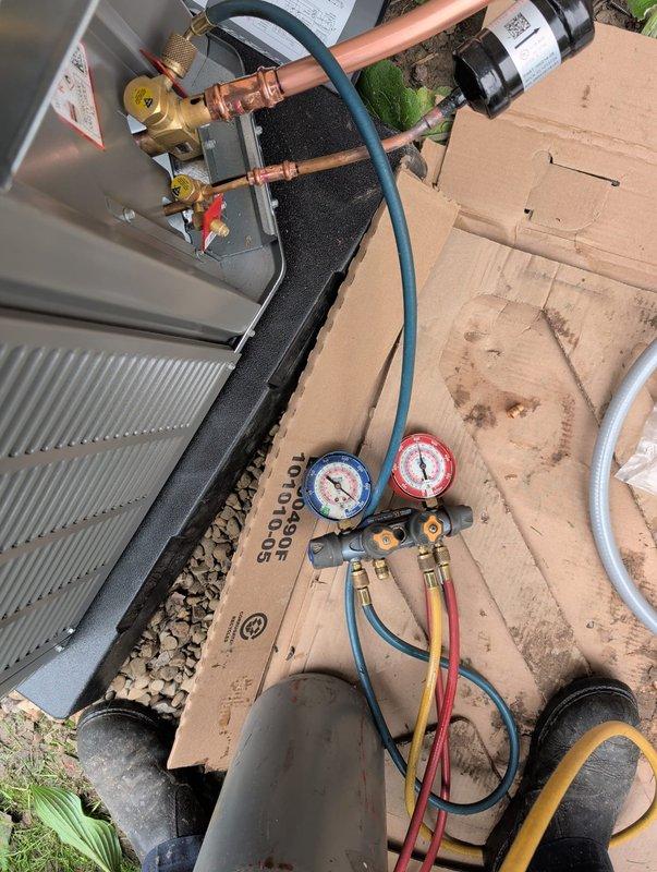 Completed full air conditioning system replacement including outdoor condensing unit and indoor evaporator coil. Installed new copper refrigerant line set with proper insulation, connected to service valves, and performed system startup with manifold gauge verification to ensure proper refrigerant charge and system operation. System tested and confirmed operational with all components functioning within manufacturer specifications.