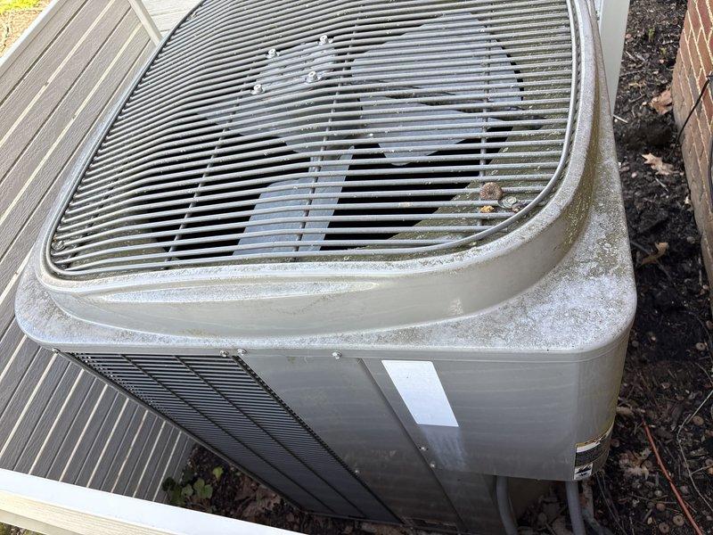Completed routine maintenance visit on residential cooling system under maintenance agreement. Inspected indoor air handler unit in attic space and outdoor condenser unit, verified proper operation of all components including condensate pump with functioning indicator lights, refrigerant lines, and ductwork connections. Noted outdoor unit showing normal weathering and surface discoloration from environmental exposure; all equipment operating within normal parameters at time of inspection.